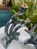 Pareja de candelabros vintage en porcelana esmaltada.